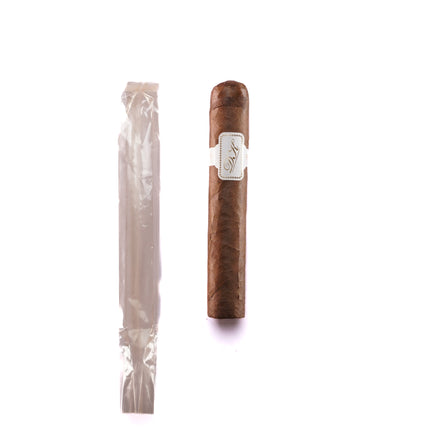Cigar and its packaging on a white background