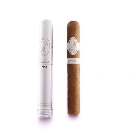 Cigar and its packaging on a white background