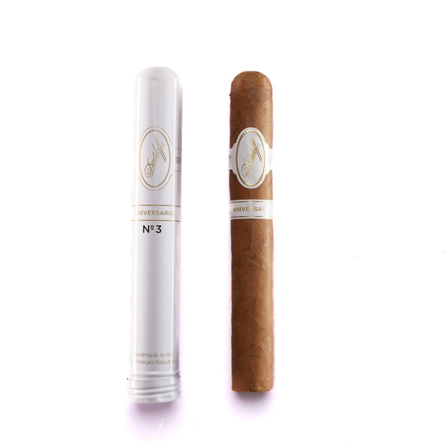 Cigar and its packaging on a white background
