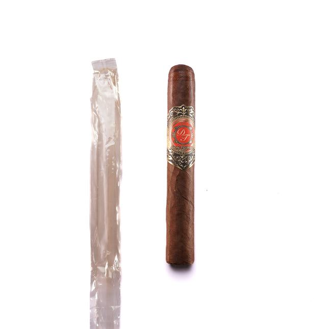 Cigar and a single-dose package on a white background