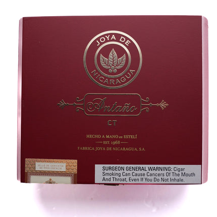 Red box of Joya de Nicaragua cigars with branding and warning label on a white background