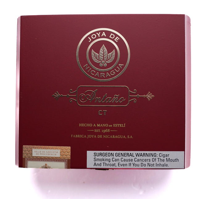 Red box of Joya de Nicaragua cigars with branding and warning label on a white background