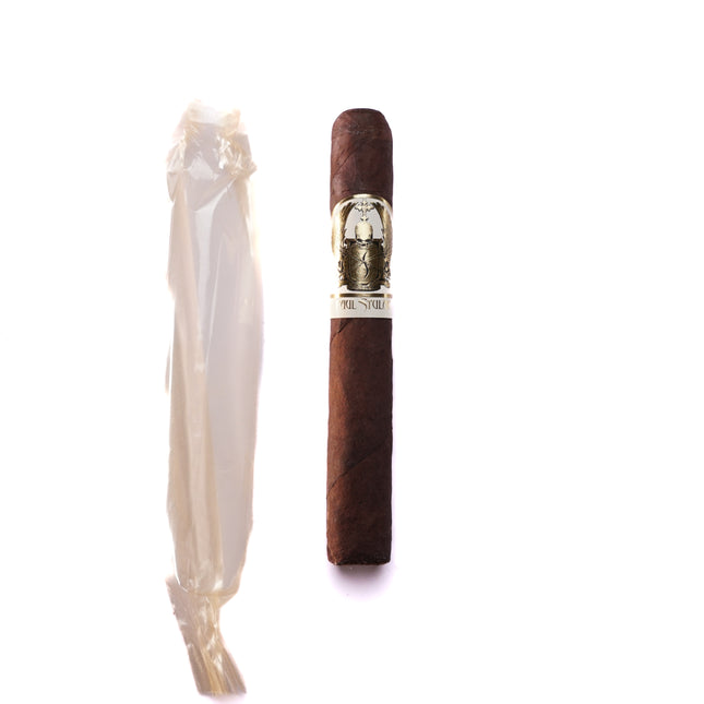 Cigar with decorative band and white ribbon on a white background