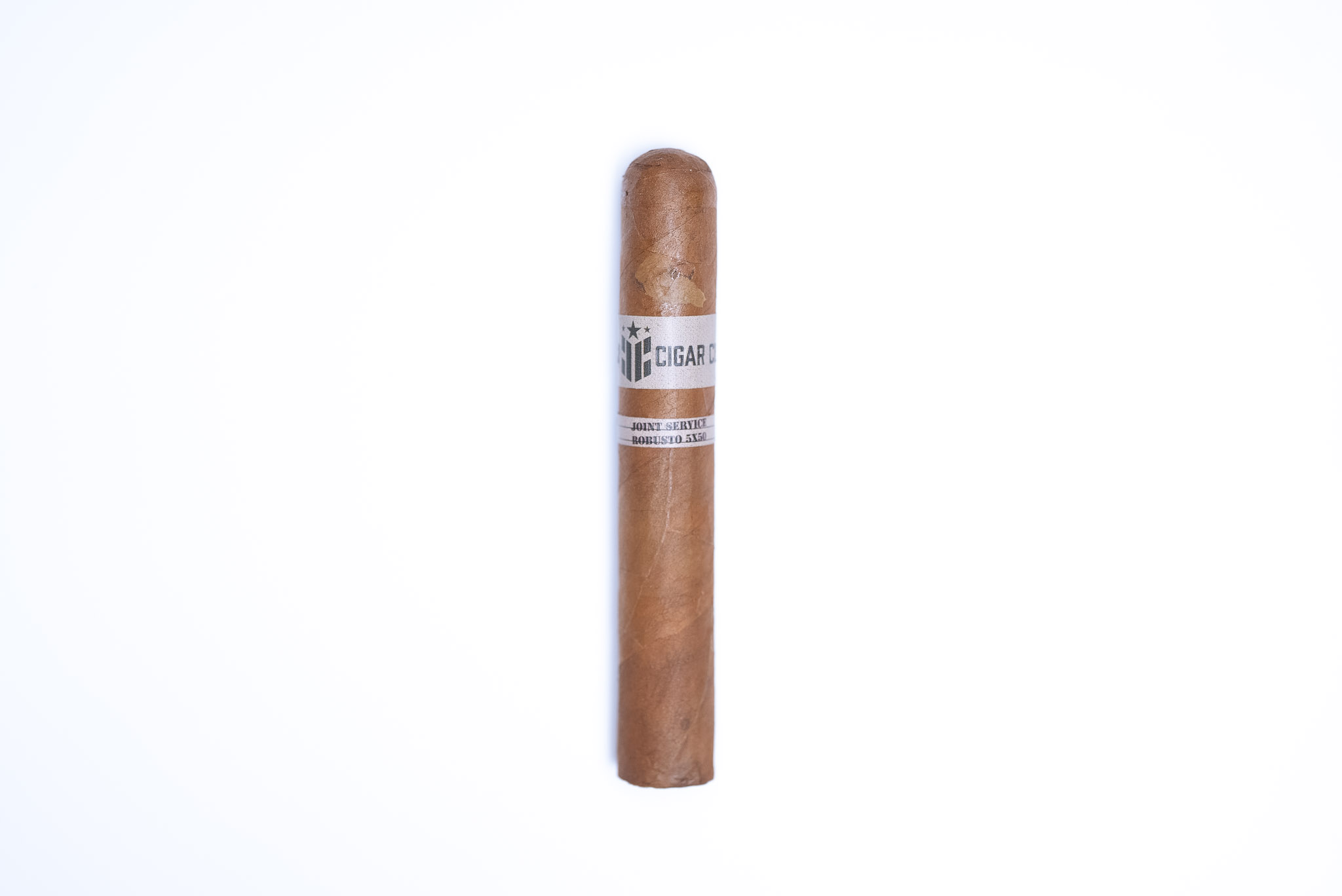 Caliber Cigar Co. Joint Service Robusto Aged 10 Months
